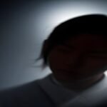 Cinematic silhouette of a Chinese drama actor on a moody film set