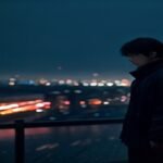 Lone figure on a rainy Seoul rooftop at night under neon light, evoking a dark Korean revenge thriller
